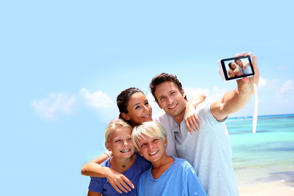 Couple and children taking family picture